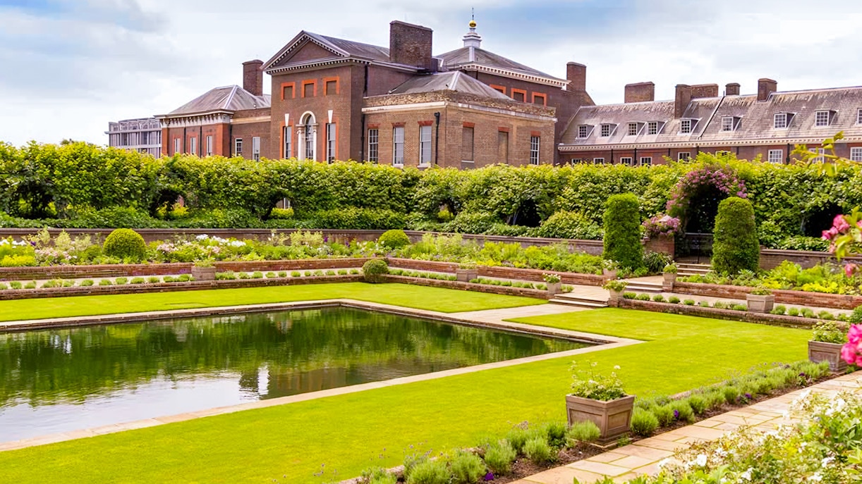 Kensington Palace Sunken Garden with vibrant flowers and historic architecture in London.