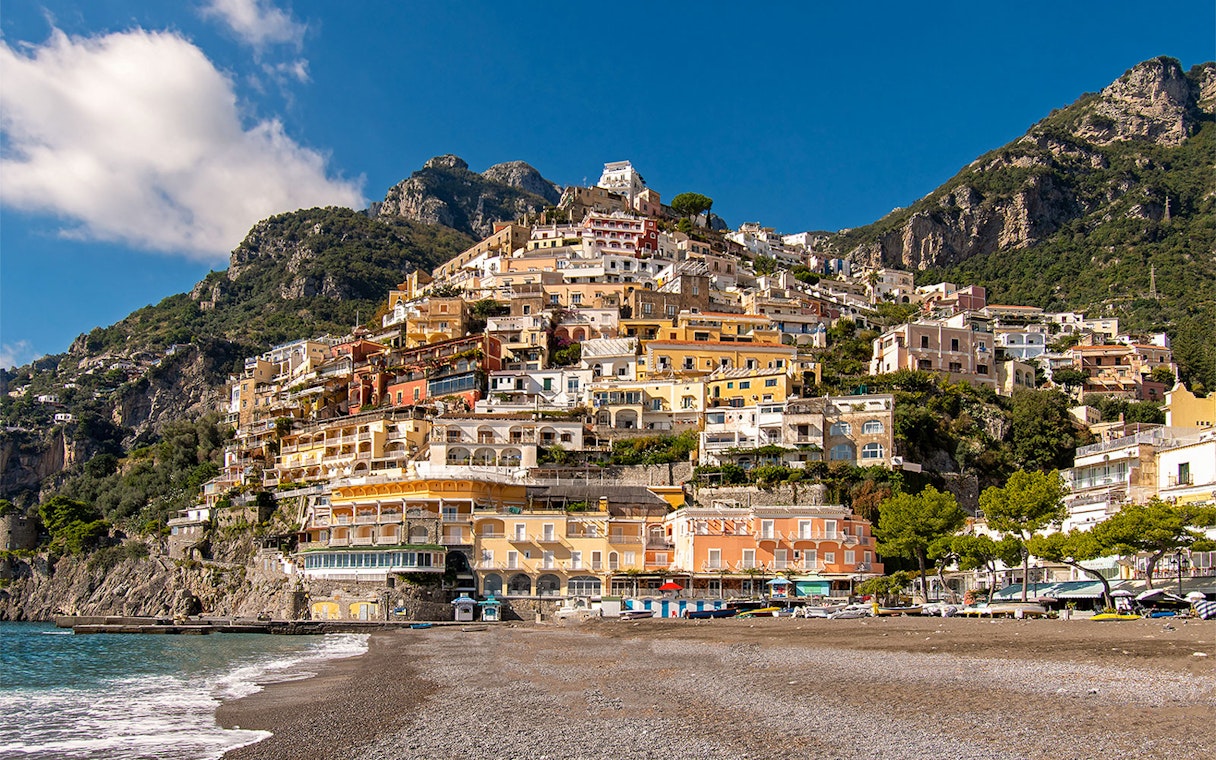 Positano beach and colorful hillside houses on the Amalfi Coast, Naples.