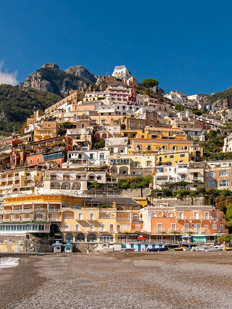 Positano beach and colorful hillside houses on the Amalfi Coast, Naples.
