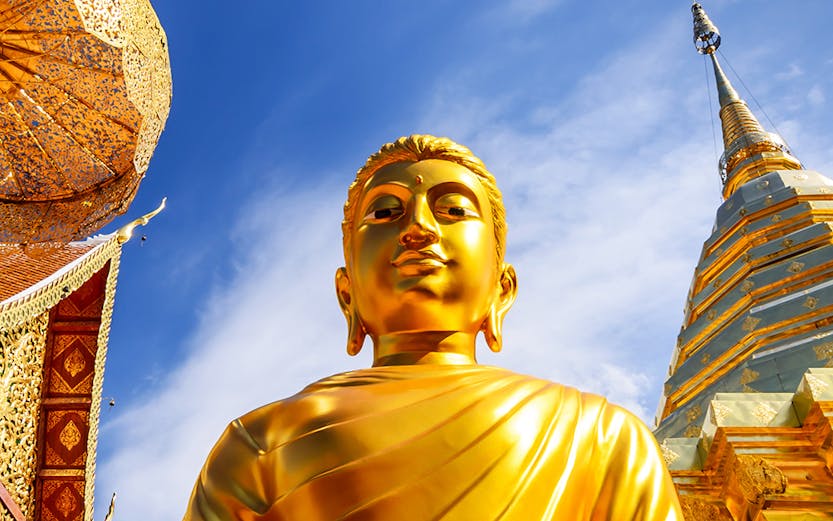 Golden Buddha statue at Wat Phra That Doi Suthep, Chiang Mai, Thailand.
