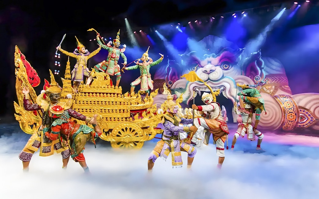 Actors in traditional Thai costumes perform a mythical scene at Phuket Fantasea.