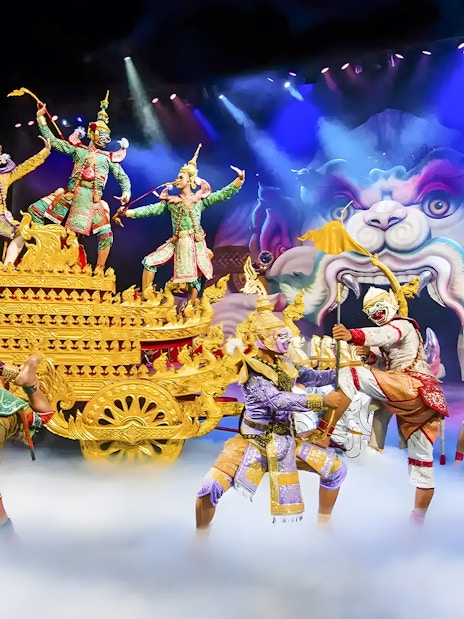 Actors in traditional Thai costumes perform a mythical scene at Phuket Fantasea.