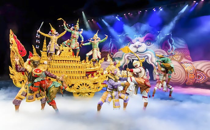 Actors in traditional Thai costumes perform a mythical scene at Phuket Fantasea.