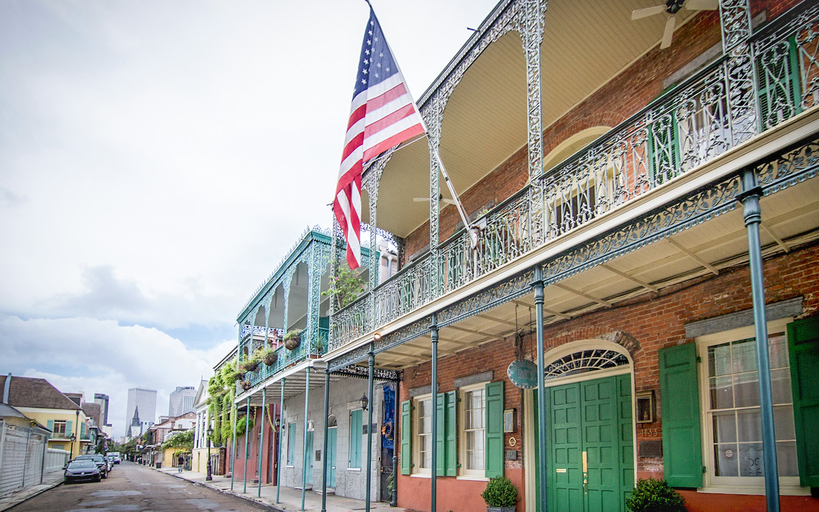Esplanade Avenue lined with historic homes and oak trees in New Orleans.