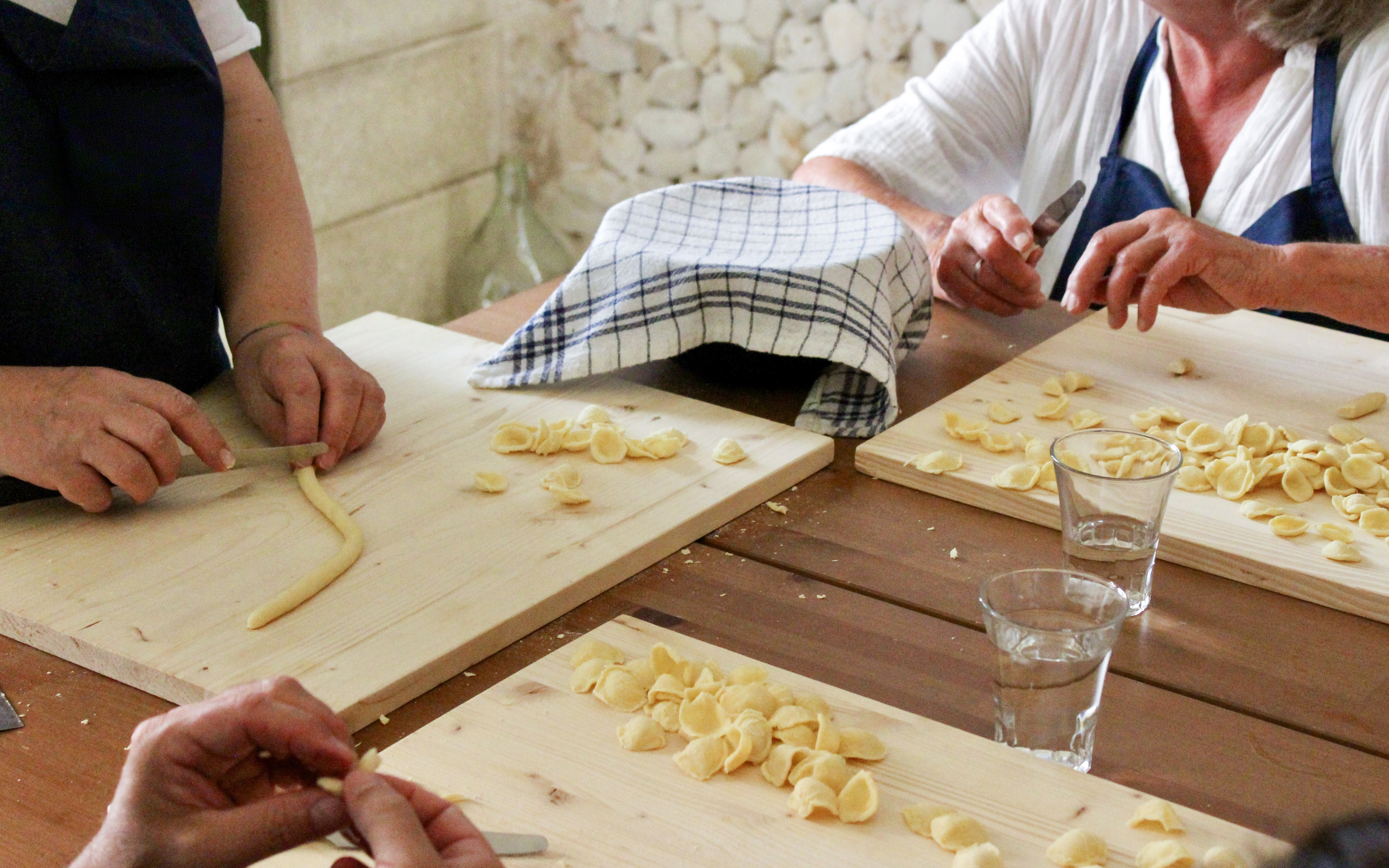 Making orecchiette pasta at Polignano a Mare cooking class.