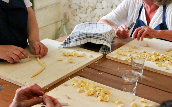 Making orecchiette pasta at Polignano a Mare cooking class.