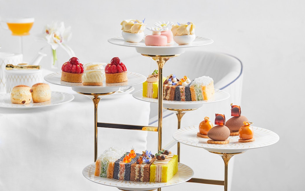 Cupcakes and pastries on a tiered stand at Pearl Afternoon Tea, Platos.