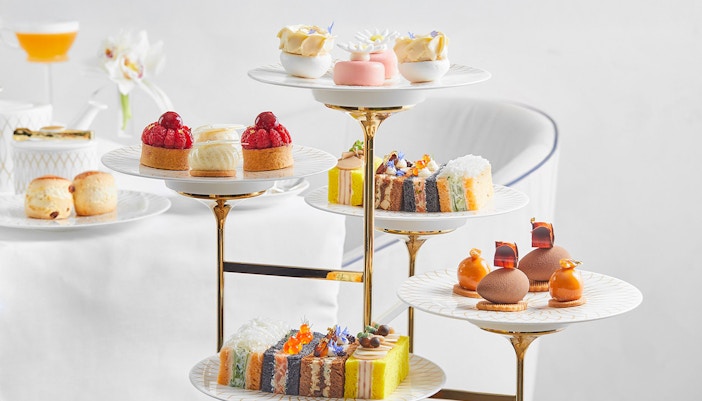 Cupcakes and pastries on a tiered stand at Pearl Afternoon Tea, Platos.