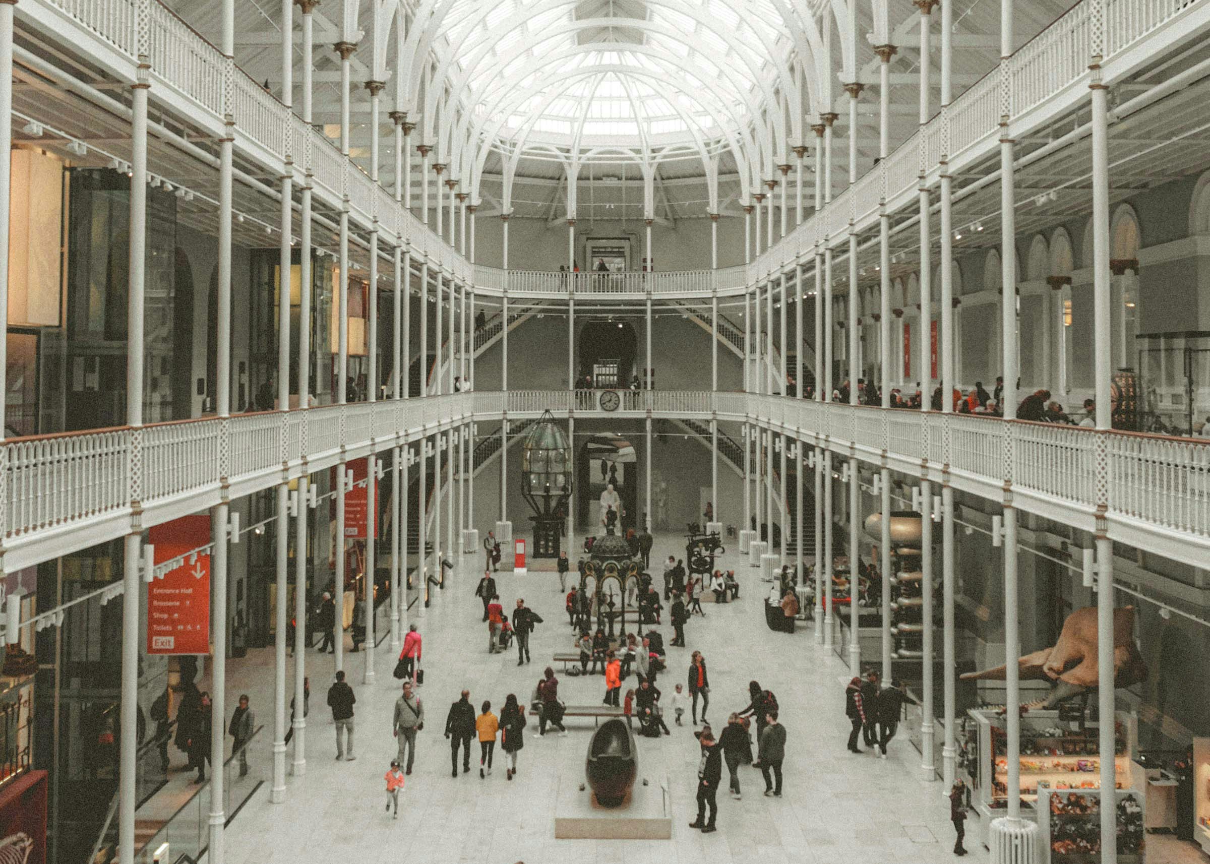 Visitors exploring the grand hall of the National Museum of Scotland.