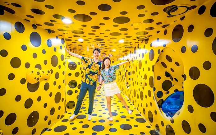 Visitors enjoying a polka dot room at SEA LIFE Busan Aquarium.