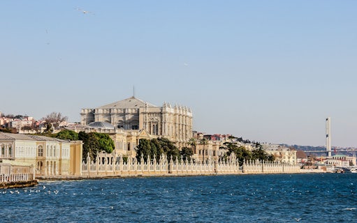 Dolmabahçe Palace along the Bosphorus with the Bosphorus Bridge in the background.