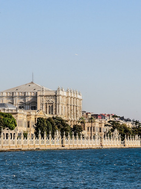 Dolmabahçe Palace along the Bosphorus with the Bosphorus Bridge in the background.