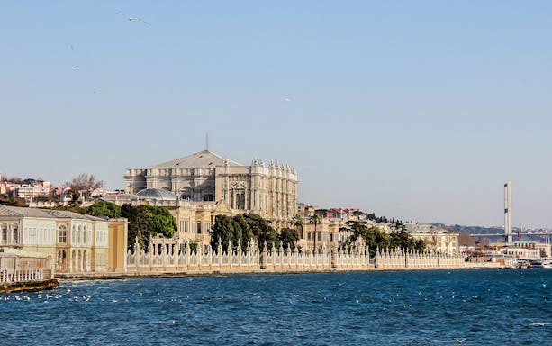 Dolmabahçe Palace along the Bosphorus with the Bosphorus Bridge in the background.