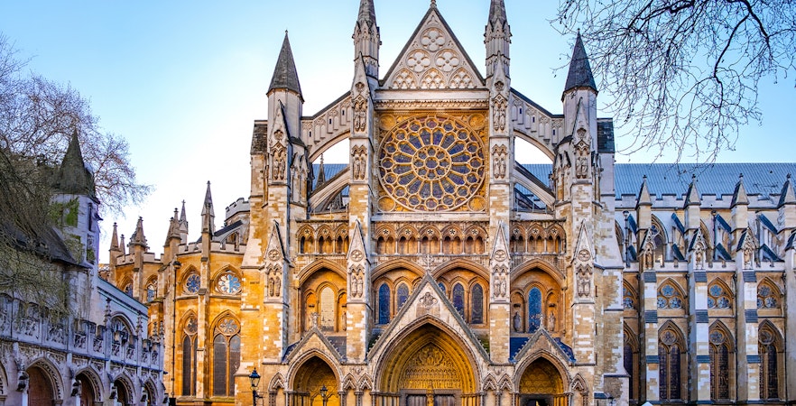Westminster Abbey exterior with Gothic architecture and rose window in London.