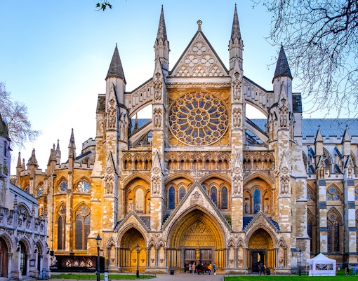 Northern entrance of Westminster Abbey with intricate Gothic architecture.