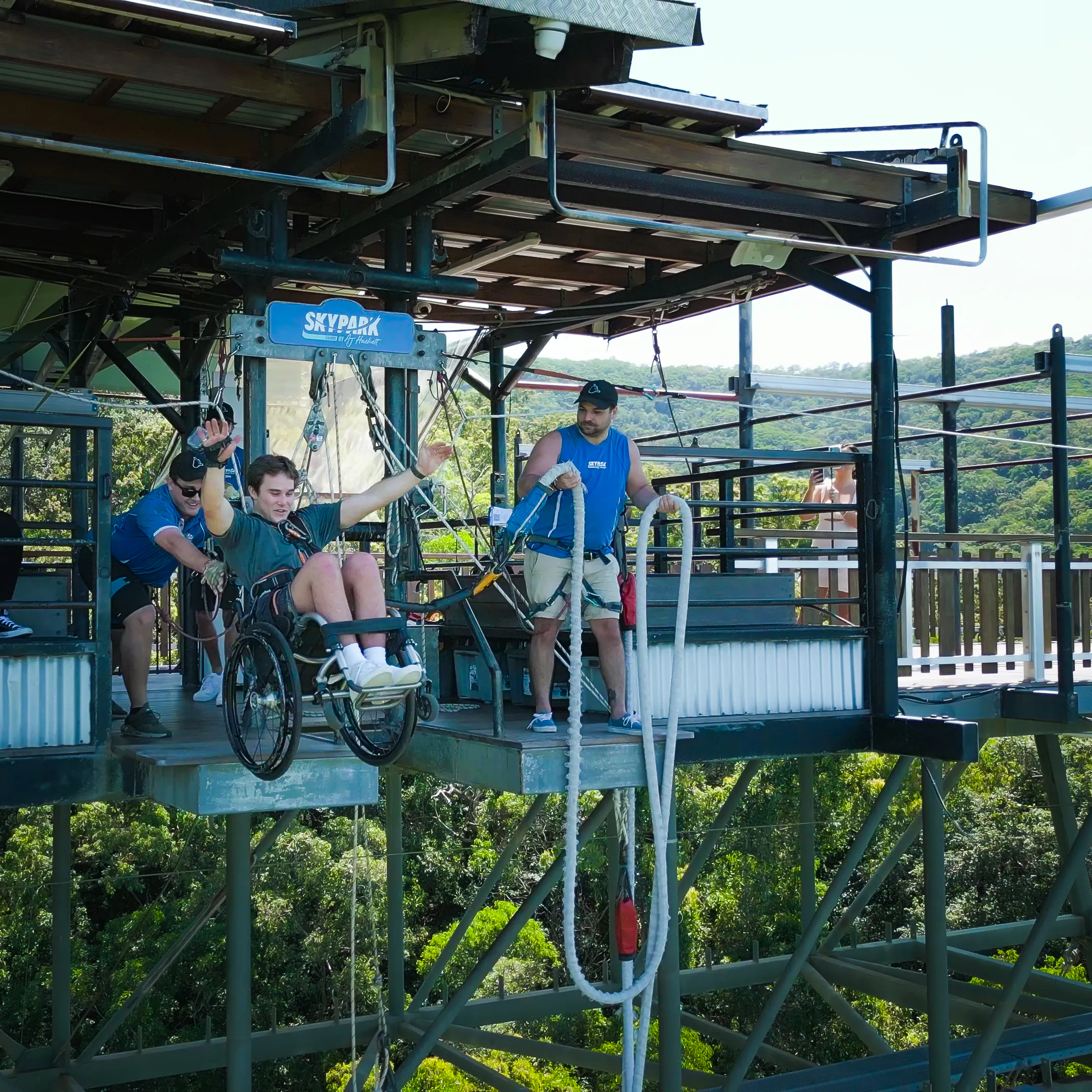Visitor in wheelchair bungee jumping at Skypark Cairns platform.