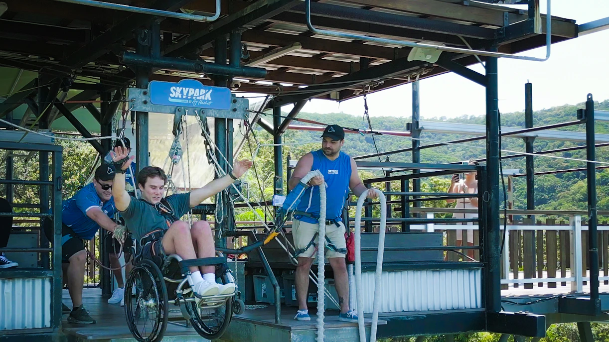 Visitor in wheelchair bungee jumping at Skypark Cairns platform.