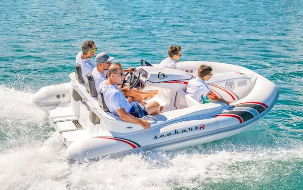 Group enjoying speedboat ride at Adventure Zone Watersports.