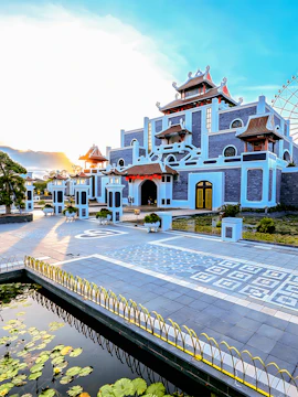 Sun World Asia Park entrance with traditional architecture and ferris wheel in the background.