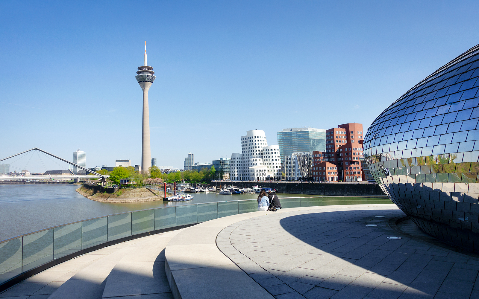 Medienhafen Dusseldorf with Rheinturm and modern architecture on city tour.