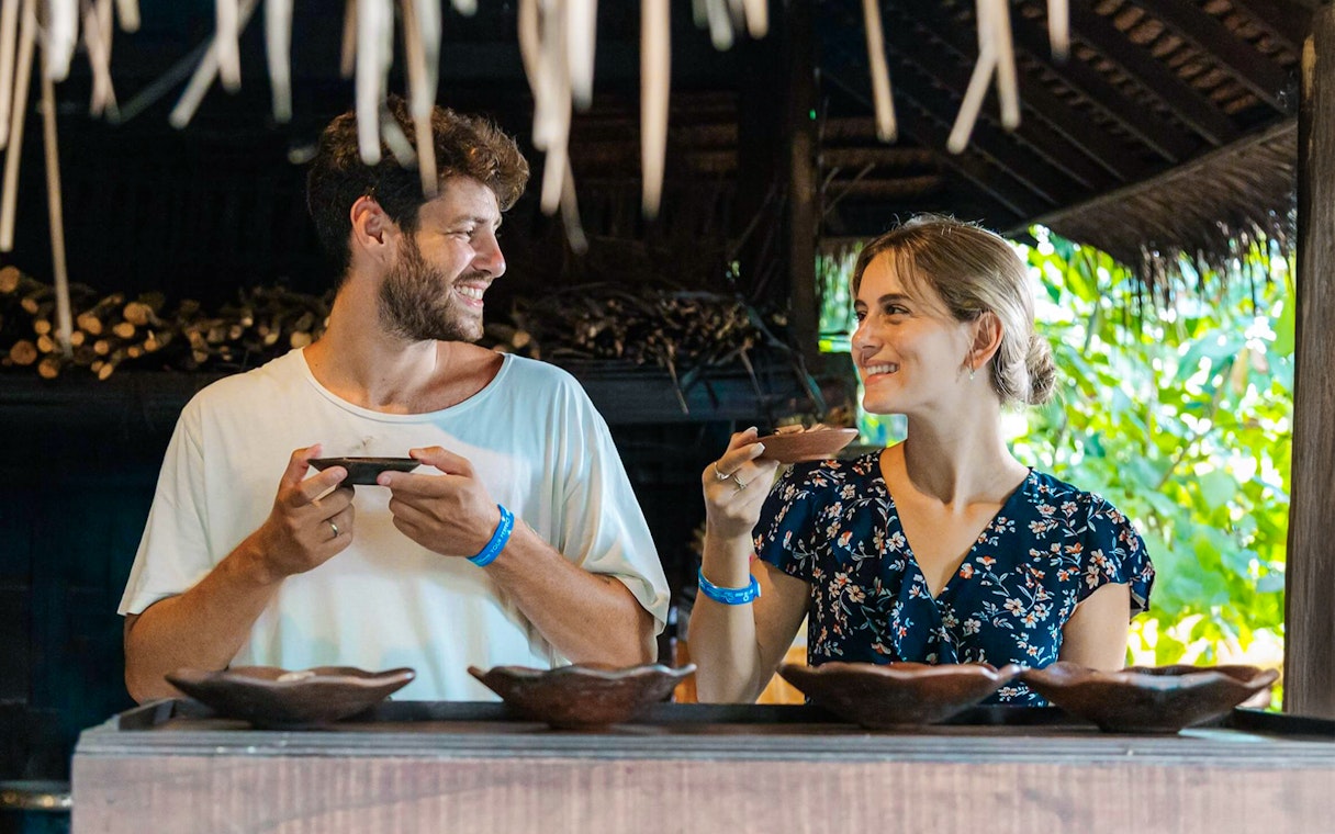 Couple enjoying coffee tasting at Alas Harum, Bali.