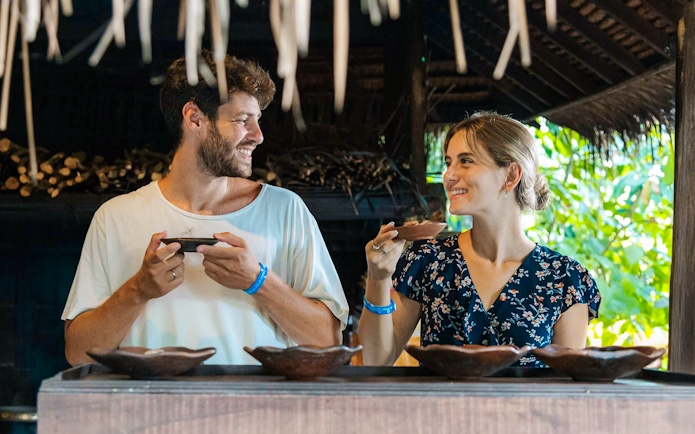 Couple enjoying coffee tasting at Alas Harum, Bali.