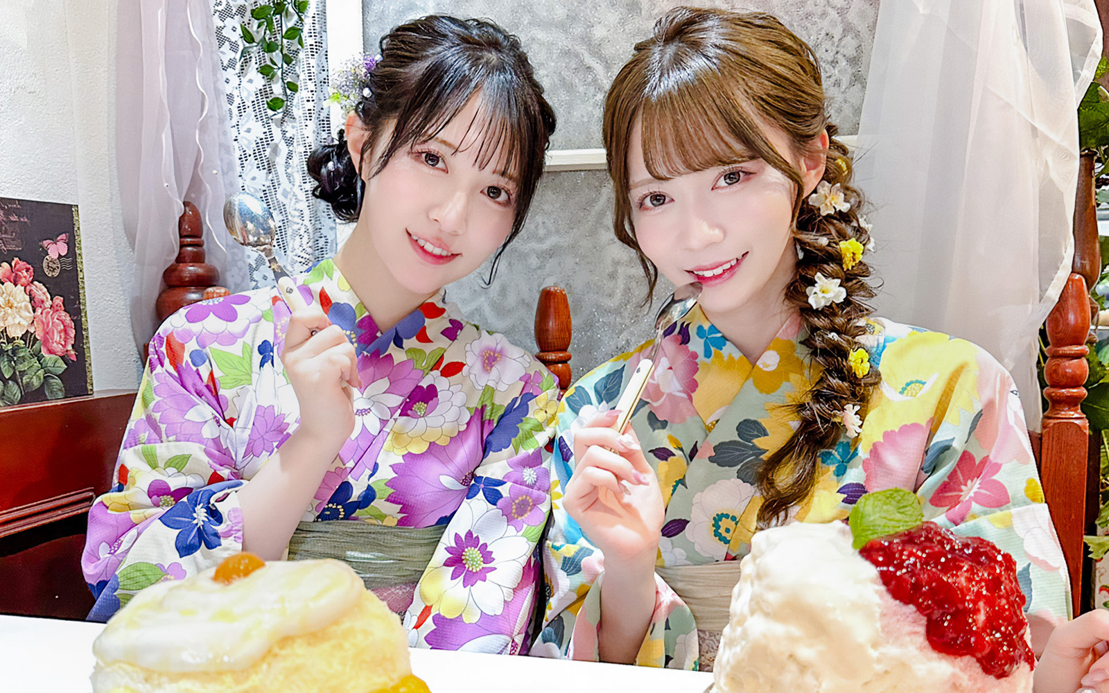 Tourists in Yukata enjoying desserts in a Japanese café.