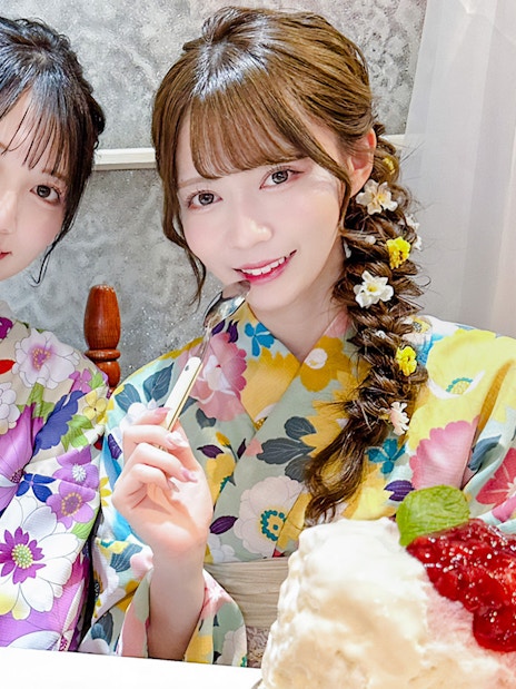 Tourists in Yukata enjoying desserts in a Japanese café.