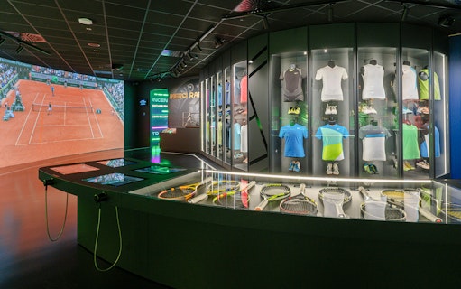 Tennis memorabilia and interactive displays at Rafa Nadal Museum.