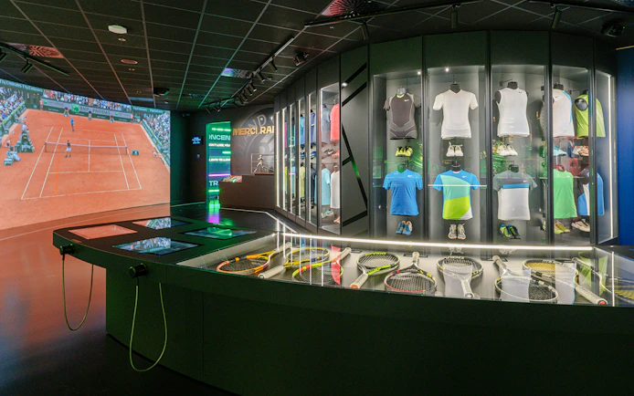 Tennis memorabilia and interactive displays at Rafa Nadal Museum.