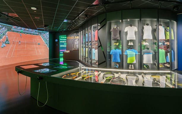 Tennis memorabilia and interactive displays at Rafa Nadal Museum.