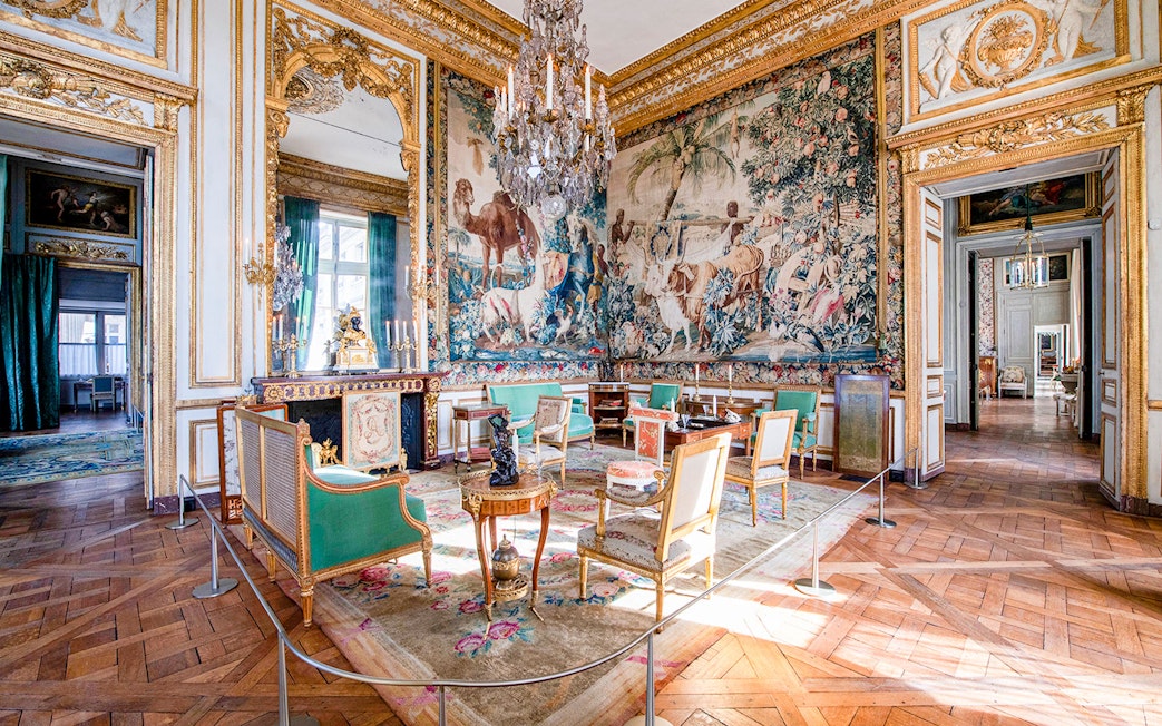 Hôtel de la Marine ornate room with tapestry, chandelier, and antique furniture in Paris.
