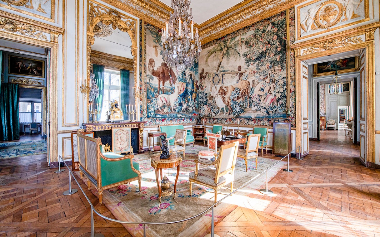 Hôtel de la Marine ornate room with tapestry, chandelier, and antique furniture in Paris.