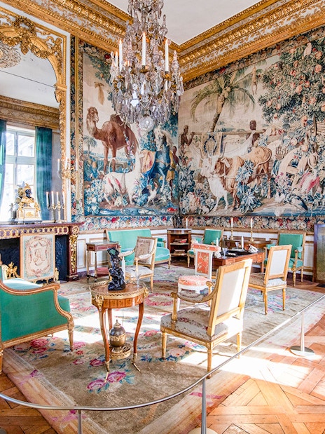 Hôtel de la Marine ornate room with tapestry, chandelier, and antique furniture in Paris.