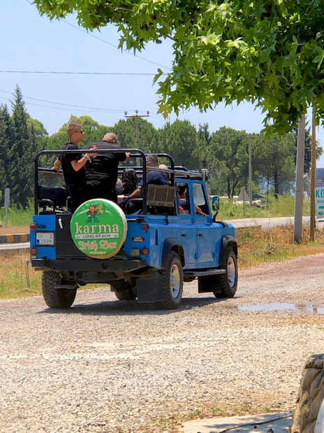 Jeep on Antalya safari tour driving through rural landscape.
