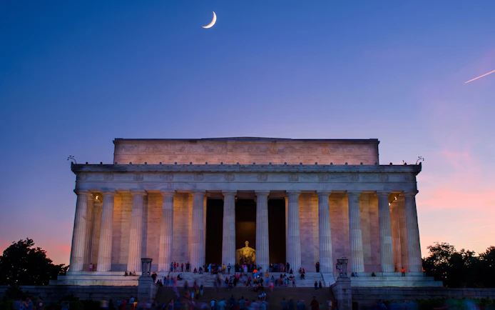 Lincoln Memorial at dusk during a guided moonlight bus tour in Washington DC.