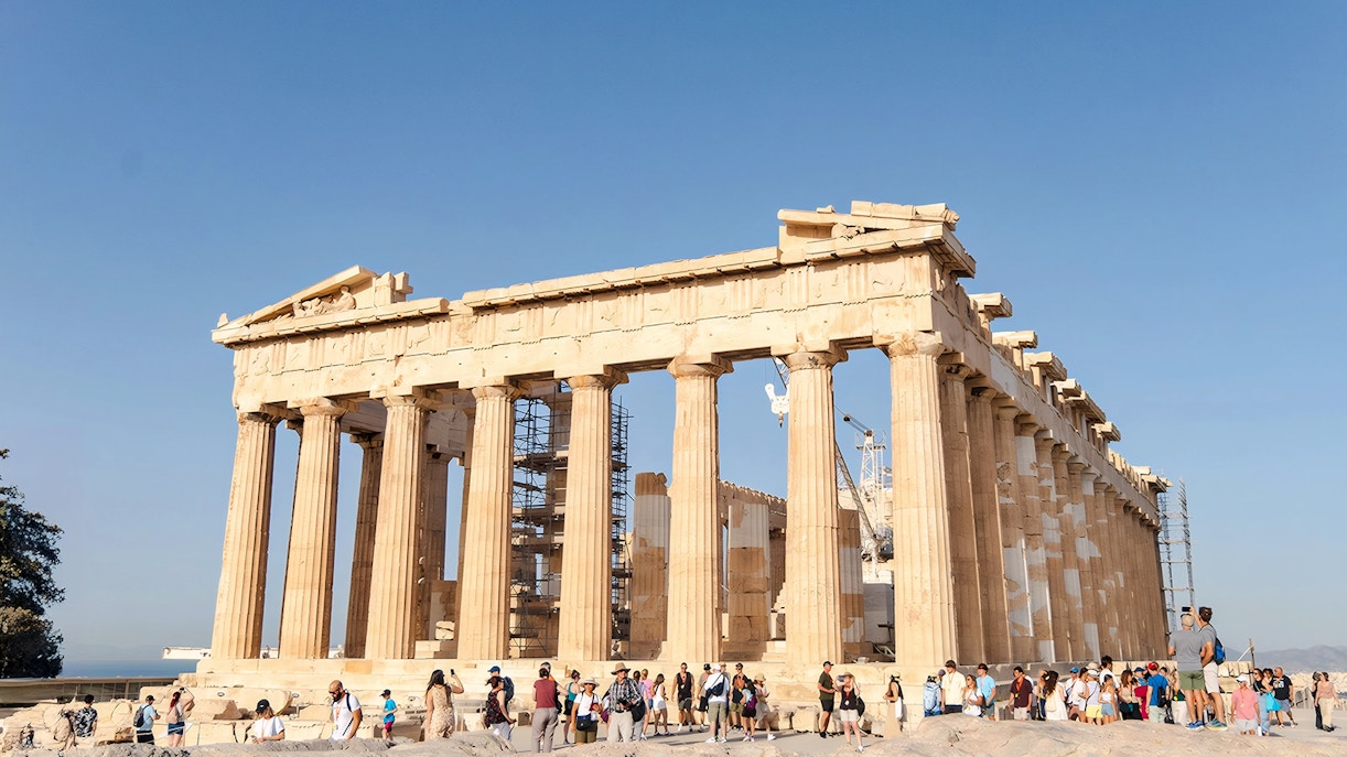 Tourists exploring the Parthenon at the Acropolis in Athens.