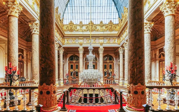 Crystal Staircase in Dolmabahce Palace, Istanbul, with ornate columns and chandelier.