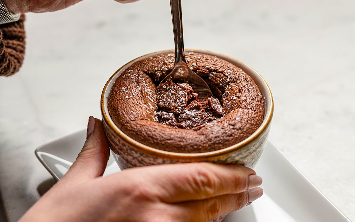 Chocolate soufflé being served at Flora Danica on the Champs Elysées, Paris.