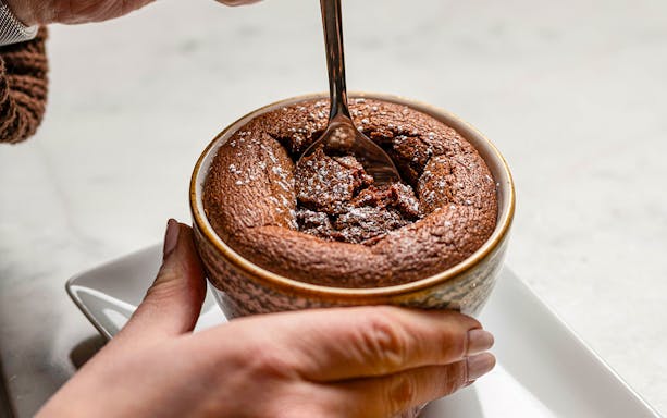 Chocolate soufflé being served at Flora Danica on the Champs Elysées, Paris.