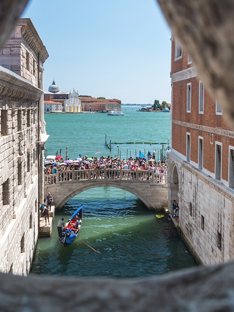 View of Venice canal and bridge from the Bridge of Sighs.