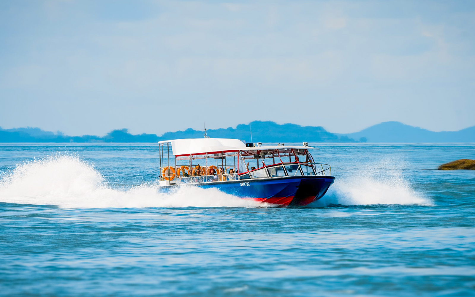Speedboat Southern Albatross cruising in Singapore waters.