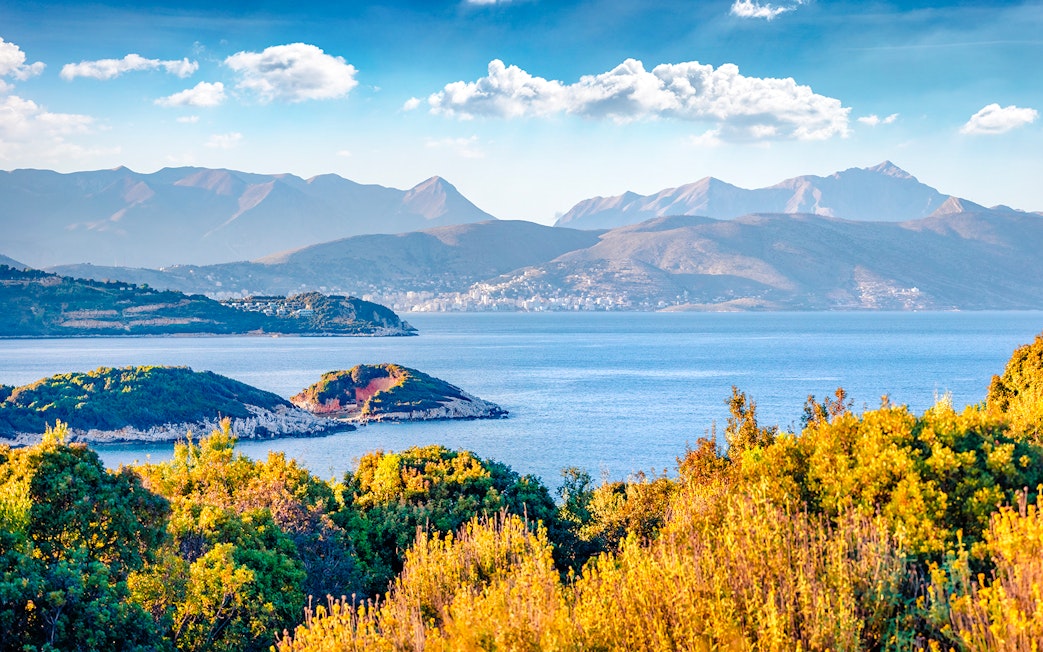 Saranda town summer cityscape with Ionian Sea and distant mountains, Albania.
