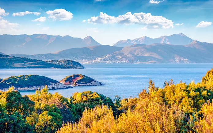 Saranda town summer cityscape with Ionian Sea and distant mountains, Albania.