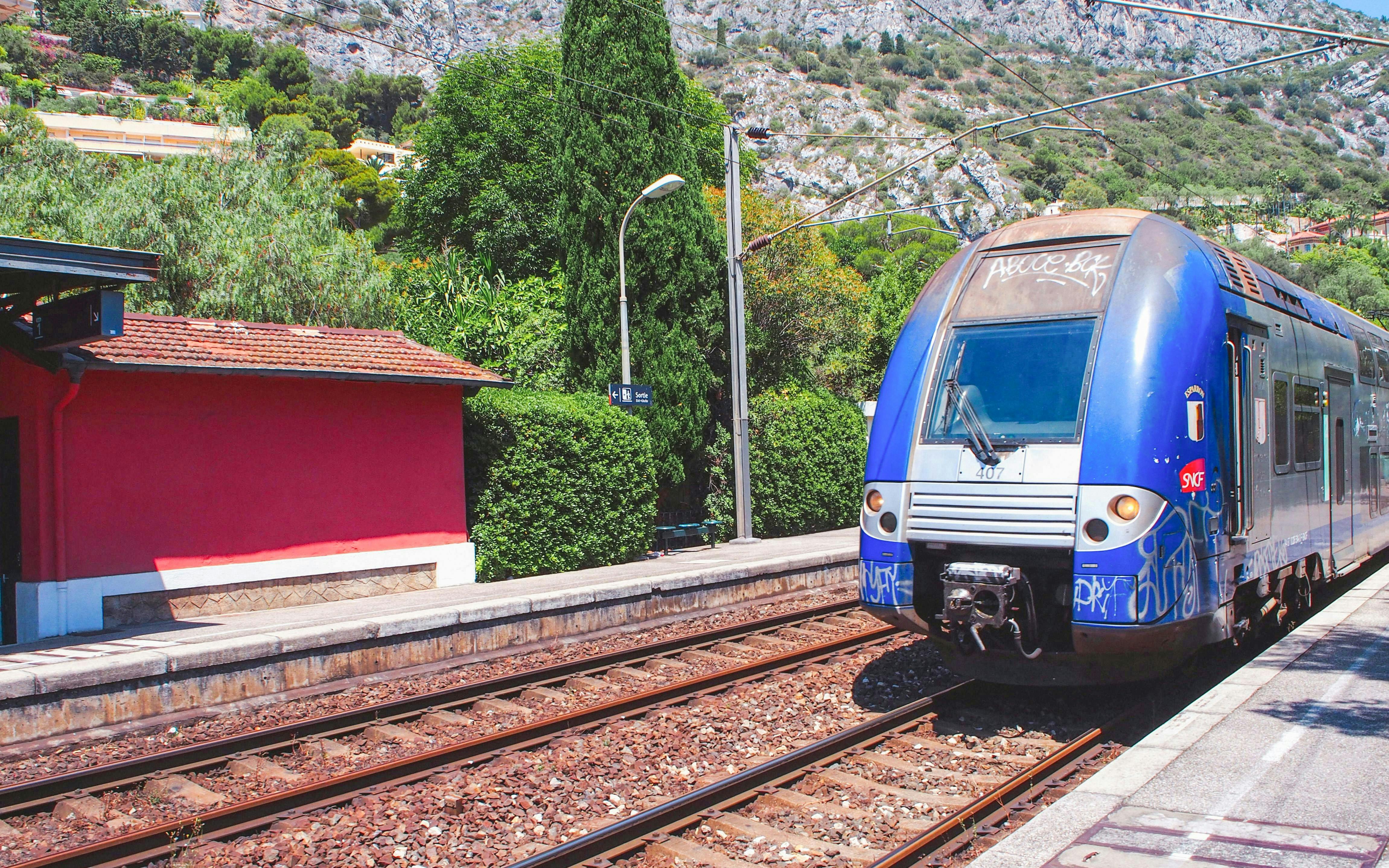 Train arriving at a station near Oceanographic Museum, Monaco.