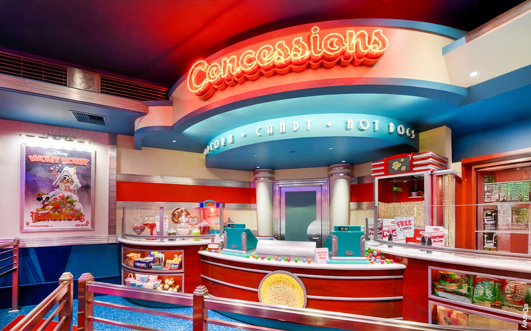 Concession stand at Disneyland Park, California offering popcorn, candy, and hot dogs.