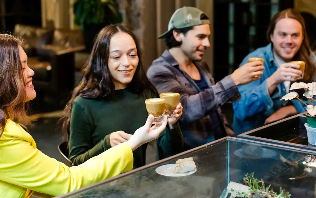 Group enjoying coffee during VIP Morning Market Experience.