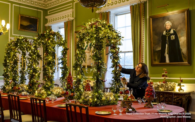 Palace of Holyroodhouse dining room decorated with Christmas garlands and festive table settings.