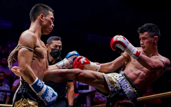 Fighters in a Muay Thai match at World Siam Stadium, Bangkok.