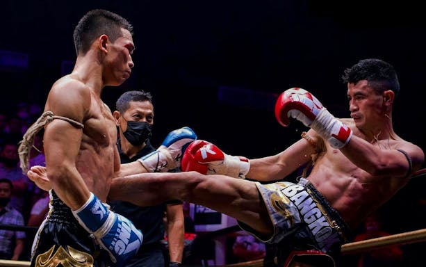 Fighters in a Muay Thai match at World Siam Stadium, Bangkok.